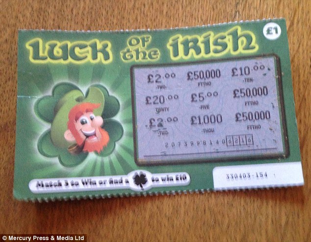 He bought the set of four scratch cards off eBay. Annette slowly scratched the 'Luck of the Irish' card to reveal three matching £50,000 symbols