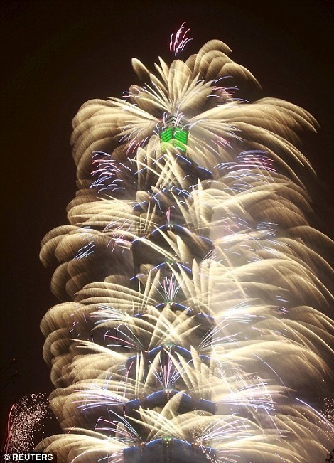 The Taipei 101 tower in Taiwan shot fireworks from the building as the clock struck midnight .