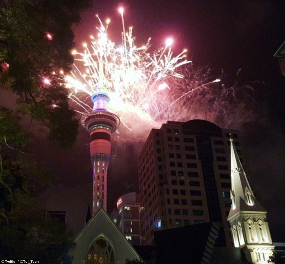 As the clock struck midnight, Auckland's Sky Tower turned into a celebratory blaze.