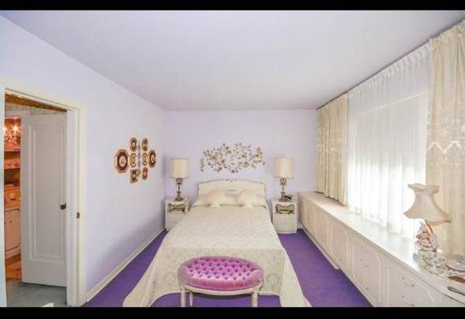 The master bedroom is a portrait of purple.