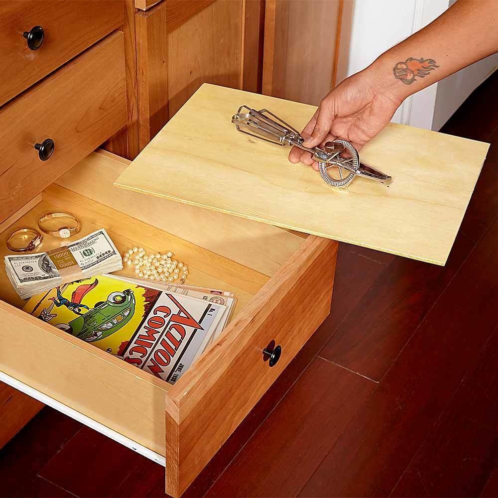Cut a 1/4 inch plywood 1/16 inch smaller than your drawer opening to create a false bottom drawer. 