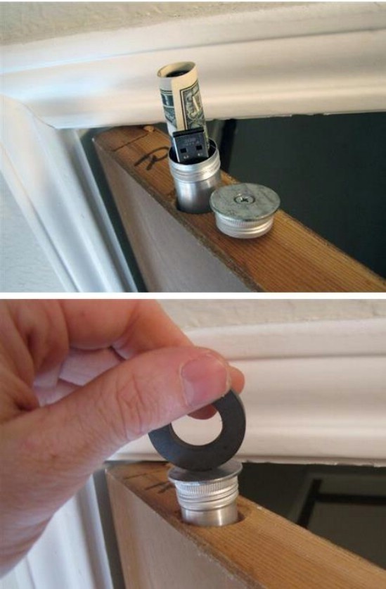 Drill a hole into the door of your door and insert a metal tube that can secretly stash cash or whatever smaller valuables you might have.