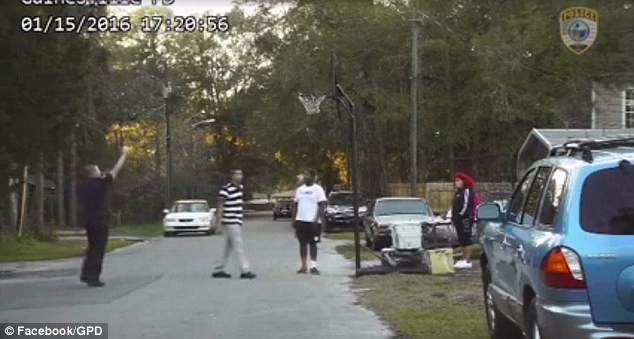 The good-hearted cop then took the ball and starts making some shots, even getting one in