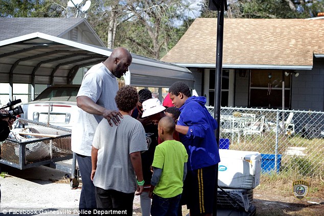 Shaq took time to huddle with the boys and tell them that they could be anything they wanted to be so long as they respected their peers, elders, and parents 