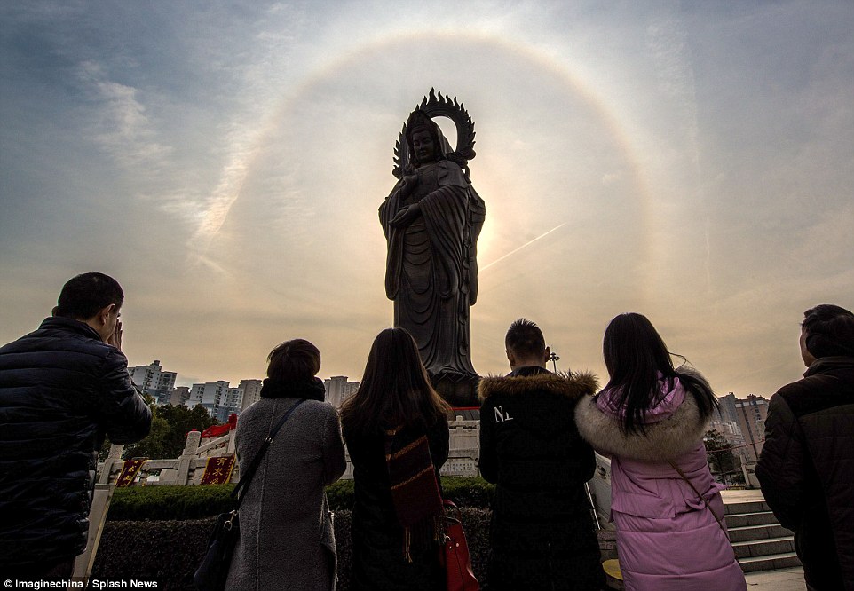 Magnificent: The rare 'Buddha's halo', which looks like a circular rainbow, had local people awe-struck and gazing up into the skies above