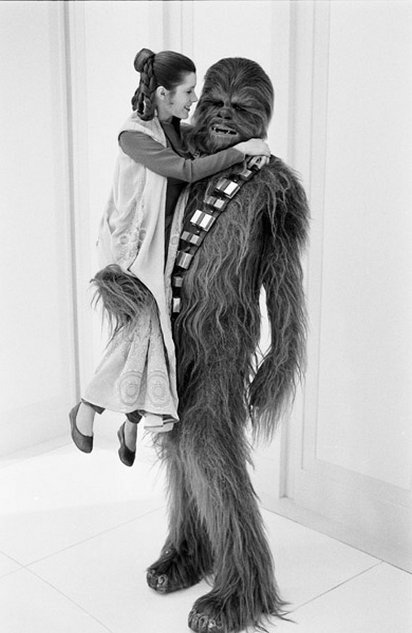 Carrie Fisher and Peter Mayhew getting cozy with each other in Star Wars.