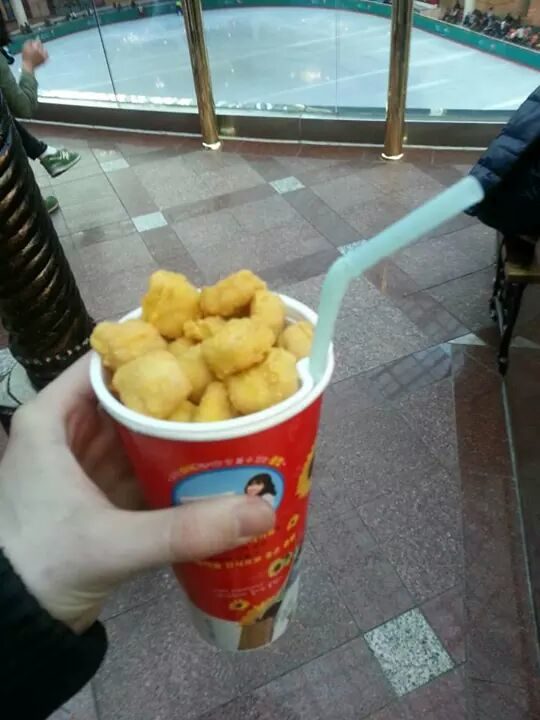A cup that holds your drink and your nuggets.