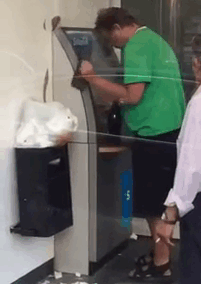 Man Withdrawing Money From An Atm In Russia