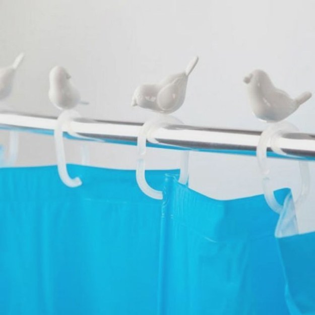 These shower curtain hooks with little birdies.