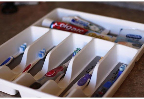 Use a utensil tray to keep family members from using the wrong toothbrush.