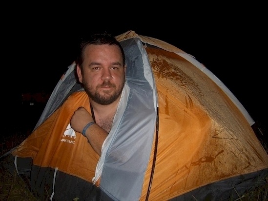 A grown man who thinks he can still fit a child's tent. 