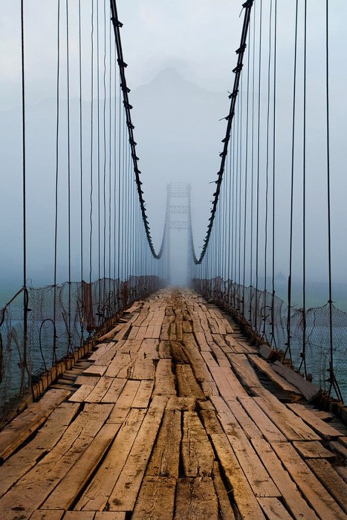 This terrifying Russian bridge has a creepy view. Even creepier: The bridge is still in use.