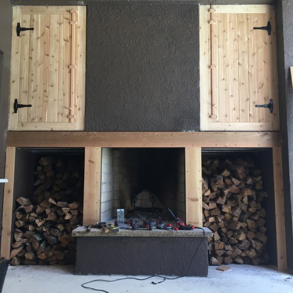 Beginning to frame in fire boxes and fireplace. Created latches for the wood doors with some scrap cedar.
