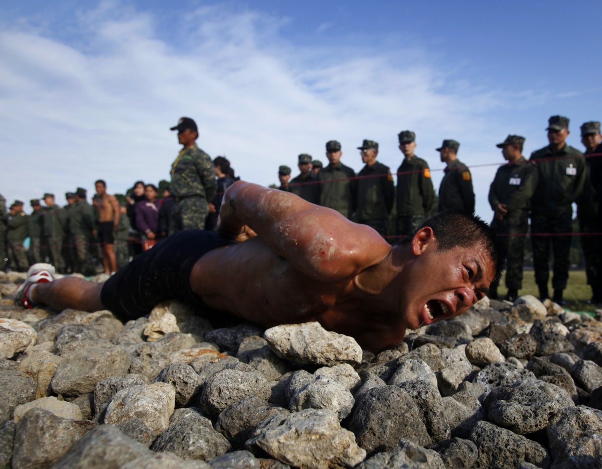 In some ways, the training simulates a landing on a rocky beach, but it appears to function mainly as a test in which the trainees must will themselves to conquer pain. "I don't fear pain!" the recruits shout as they cross the razor-sharp rocks.