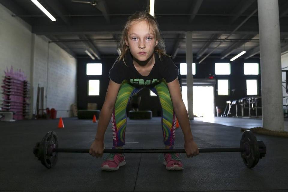 Milla Star Bizzotto, 9, trains at her father's gym, Focus Movement Academy, in Miami Shores. She competed in a BattleFrog 24- hour obstacle race in hopes of inspiring kids to eat healthy and be more active.