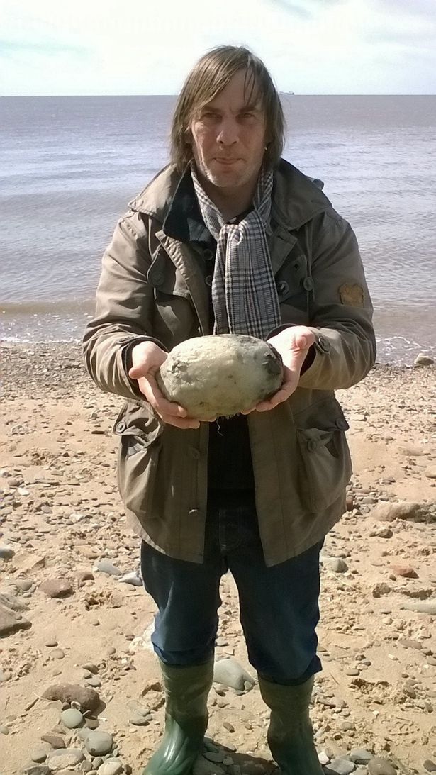 Gary Williams poses with the lump, which he and his wife found on Middleton Sands beach in Lancashire