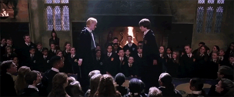 During this fight scene between Harry Potter and Draco, when Draco falls off the table, a camera man can be spotted in the crowd of onlookers.