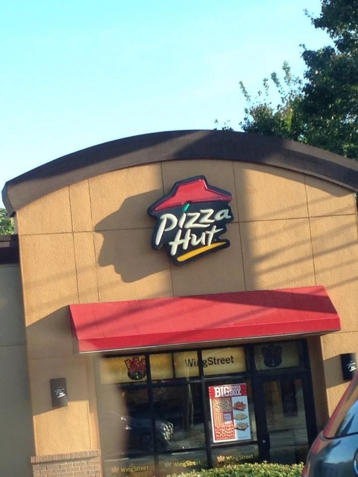 Pizza Hut, or just a dude with a hat?