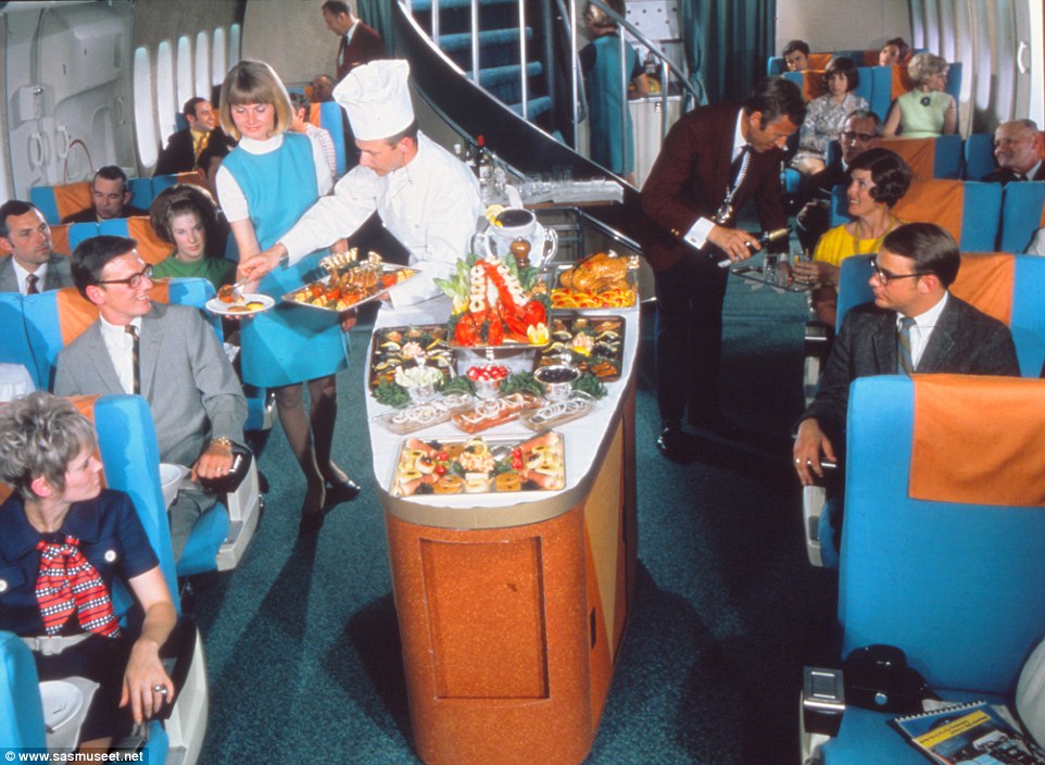 This mock up of cabin service in the 1970s show eager customers waiting to be served from the central reservation where whole lobsters, chicken and racks of lamb and being served