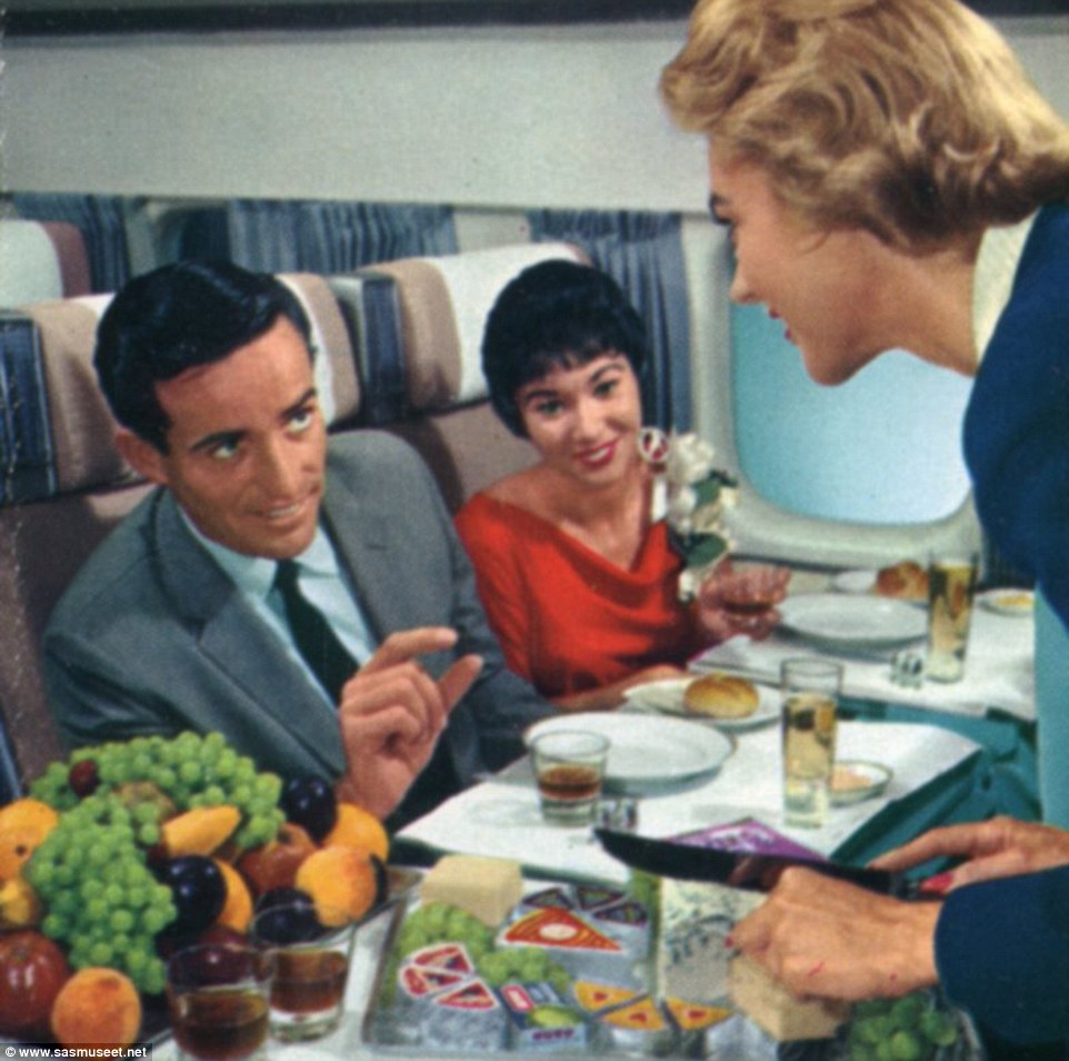 It must really be the golden age of flying as a passenger asks for just a little bit of cheese from the impressive looking platter 