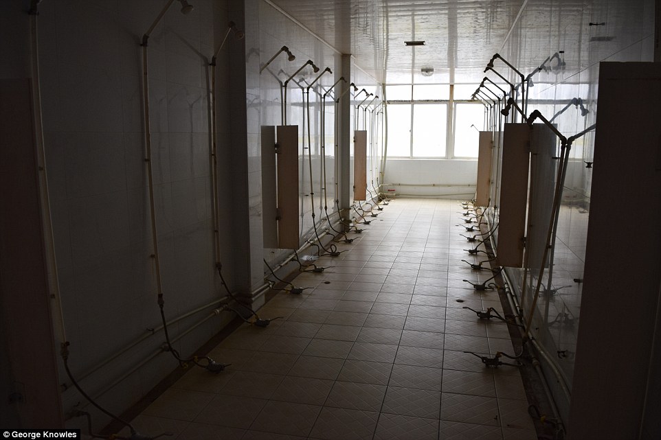 Cattle-class: The dormitories on the outskirts of Shanghai can house 6,000 but do not have private bathrooms, so up to 20 workers showered at a time