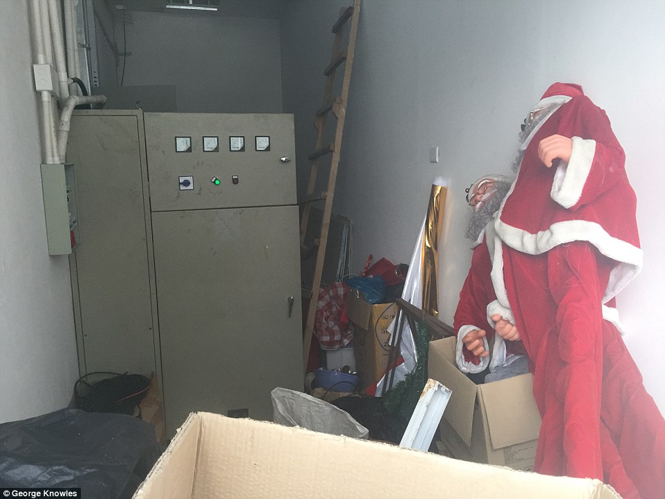 Junk: The site where up to 6,000 workers were housed is still littered with the remnants of workers' lives, including a Santa Claus outfit