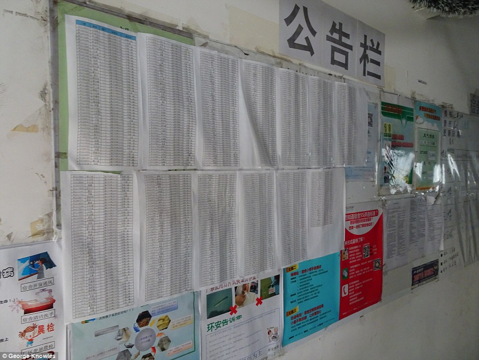 Rules: The corridors at the dormitory complex carry posters with details of working patterns and signs about safety and hygiene