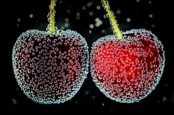 Black cherries with tiny bubbles.