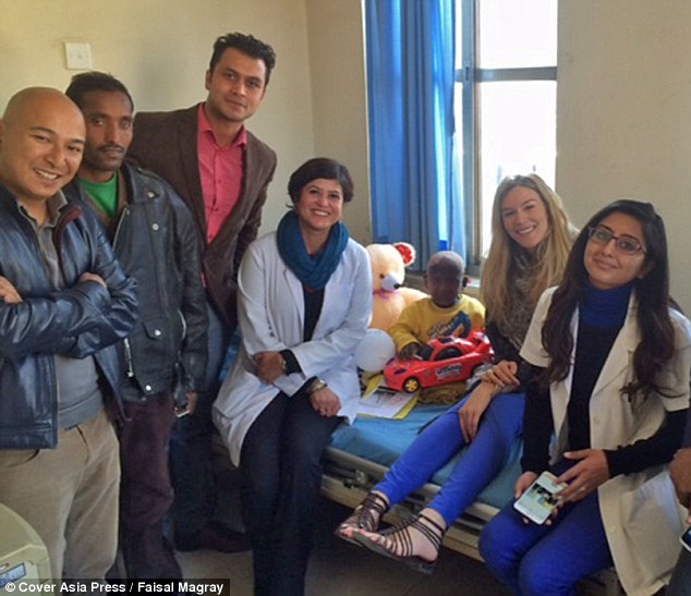Help at last: His parents have been able to do nothing but watch him get worse over the years, until Joss Stone (pictured centre) heard about his plight and decided she could do something to help Ramesh and his family