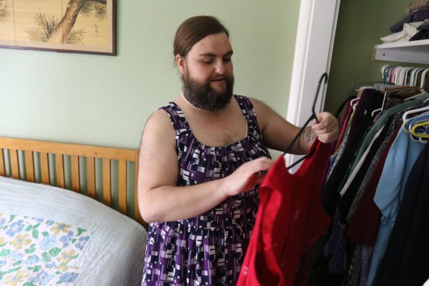 ***STRICT ONLINE EMBARGO UNTIL 00.01AM GMT THURSDAY 9TH JUNE 2016*** *** EXCLUSIVE - VIDEO AVAILABLE *** SPRINGFIELD, ORE - January 03: Jennifer Rose Geil selects outfit to wear from her closet on January 3, 2015 in Springfield, Oregon. A woman with excess facial hair has ditched her razors and grown a full beard ñ and claims sheís never felt sexier. Rose Geil, 39, first noticed her excess hair when she was just 13 and started shaving immediately. The devastated teenager, from Oregon, America, quickly realised she would have to shave every day to keep the stubble at bay. But after years of shaving, plucking and expensive laser removal procedures, Rose has now decided to accept her whiskers ñ and couldnít be happier. PHOTOGRAPH BY Michael Sullivan / Barcroft Images London-T:+44 207 033 1031 E:hello@barcroftmedia.com - New York-T:+1 212 796 2458 E:hello@barcroftusa.com - New Delhi-T:+91 11 4053 2429 E:hello@barcroftindia.com www.barcroftimages.com