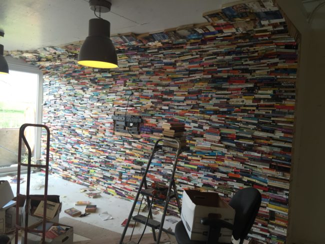 Amazingly, he started running out of books and began laying them flat on the ceiling.