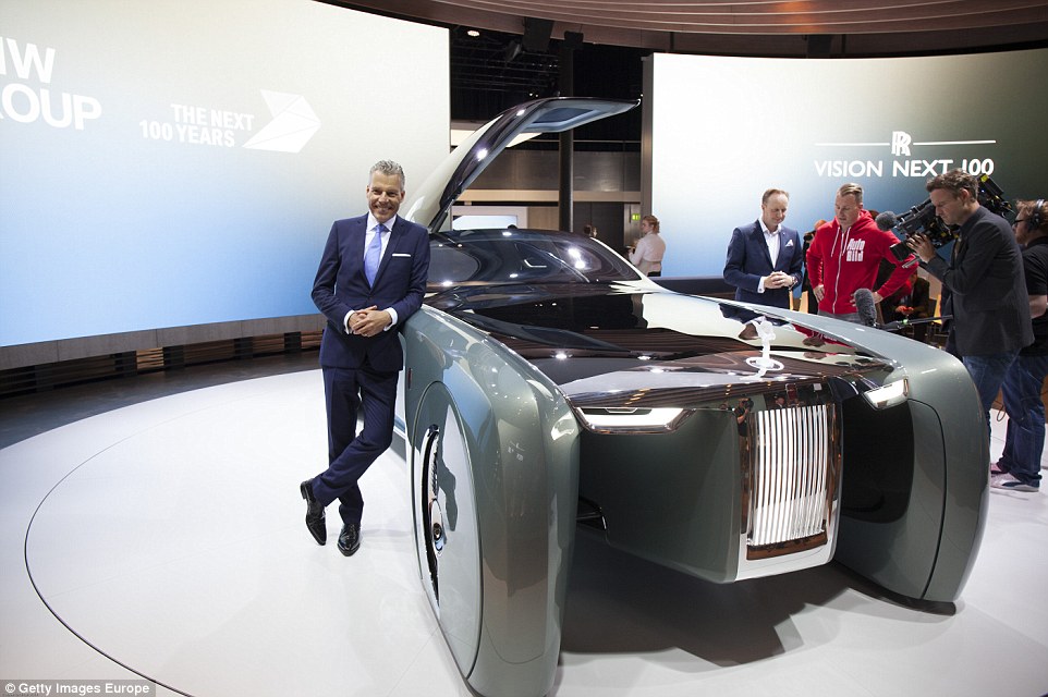 Chief executive of CEO of Rolls Royce Torsten Muller Otvos poses next to the Vision Next 100 concept Rolls oyce at the Roundhouse on June 16, 2016 in London, England. BMW Group unveiled three of their Vision Next 100 vehicles, Mini, Rolls Royce and BMW to celebrate their centenary year.  The future Rolls Royce embodies future automotive luxury, offering the passenger a personalised retreat to work or rest while the car drives itself to the destination. The Rolls Royce is 5.9m in length and has a Virtual "stewardess" called Eleanor, named after the model who inspired the iconic RR bonnet ornament.  (Photo by Stephen Hardman/Getty Images for BMW)