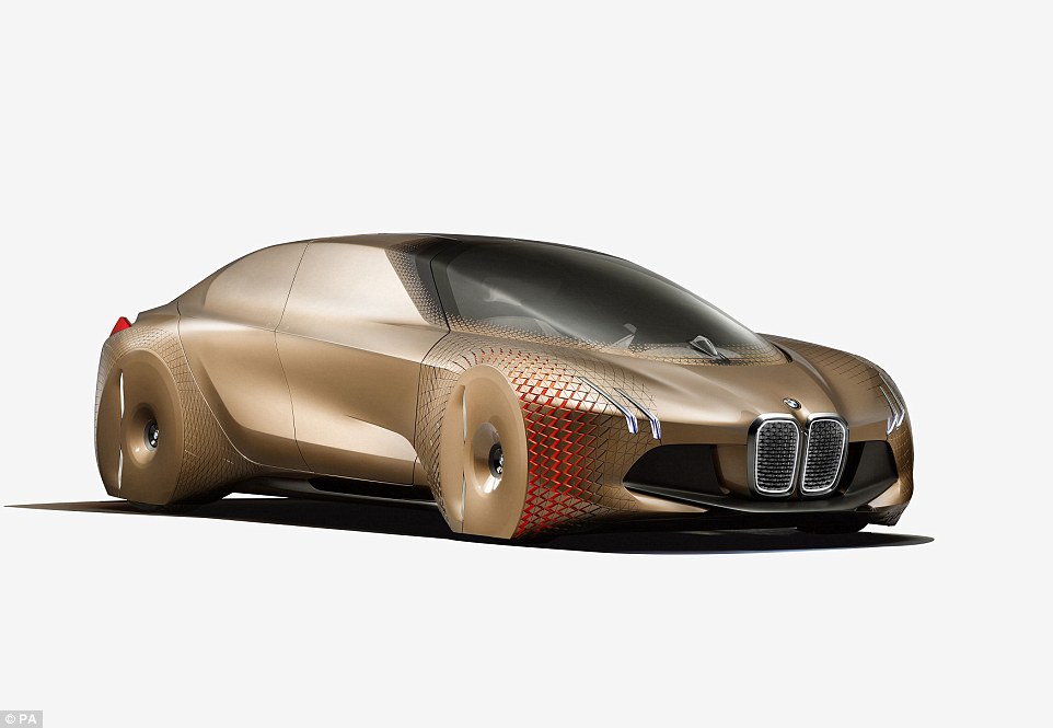 BMW's concept car is sleek and futuristic looking with a gleaming gold finish. The artwork shows the rendered computer designs during the development process
