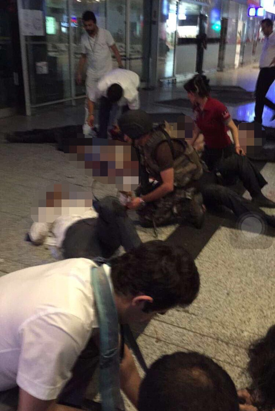 Paramedics and special forces officers at the scene help the more than 140 wounded at the airport, with Turkish officials saying the death toll will rise to 50