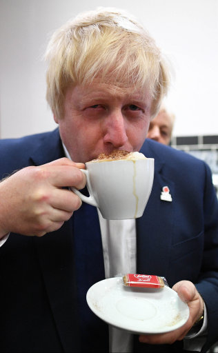 Boris Johnson drinks a cup of coffee as he talks to voters in Selby, North Yorkshire as he tours the country on the final day of campaigning before Thursday's EU referendum.