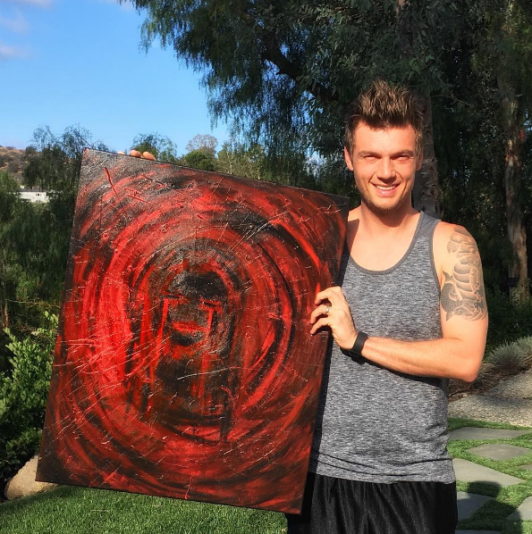 Here he is with his second painting ever. It's called "Bearing Mothers Pain" and a portion of the proceeds went to children's cancer research.