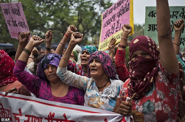 Indian Dalit women shout slogans during a protest against a gang-rape of four Dalit girls in New Delhi, India