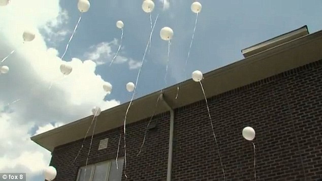 The families went outside the clinic to release balloons and butterflies in Katelyn's memory
