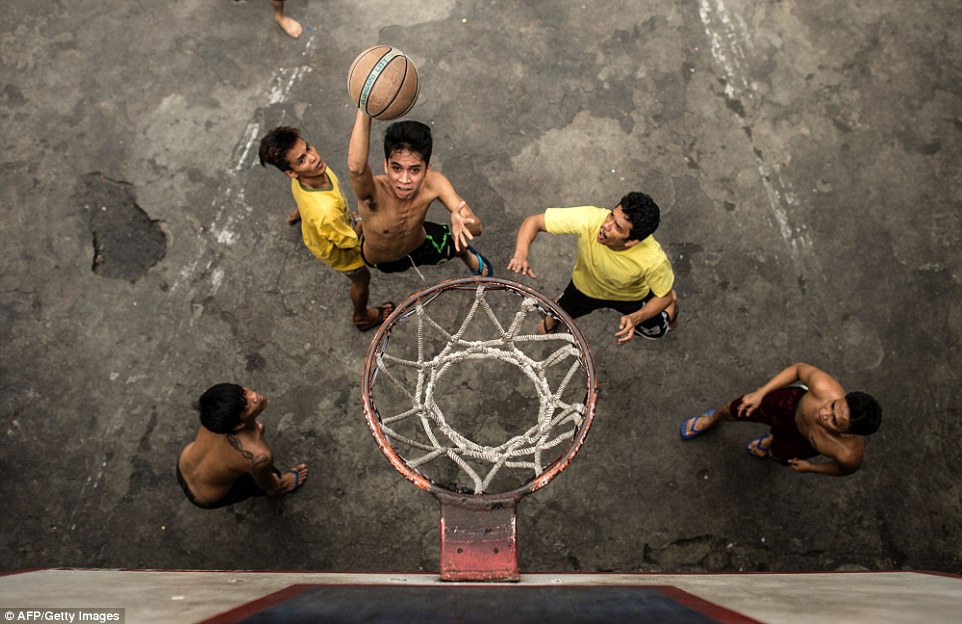 It's skins vs shirts as inmates play basketball inside the Quezon City Jail in Manila