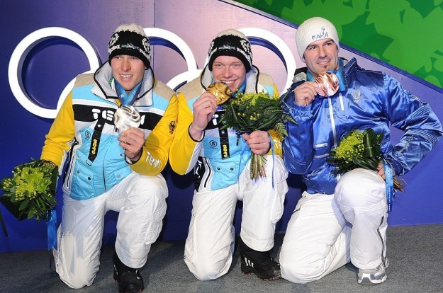 Biting your medal can be hazardous. In 2010, German luger David Moeller (left) chipped his front tooth while biting his silver medal for photographers.