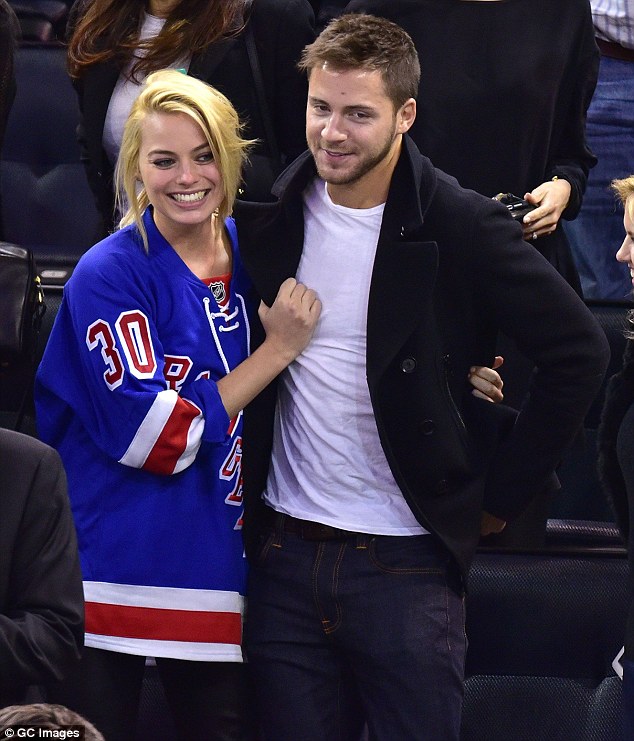 Not just yet: Margot Robbie has dismissed claims that she has secretly tied the knot with boyfriend Tom Ackerley by insisting she is too busy to get married 