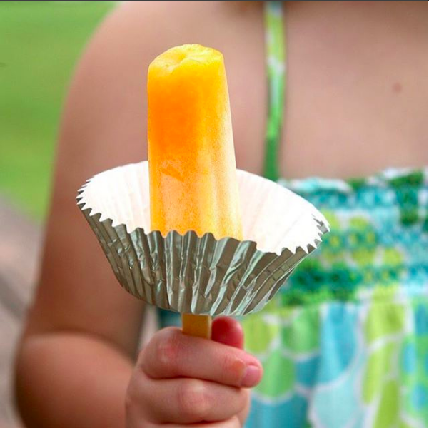 Stick a cupcake liner on a popsicle stick to keep it from dripping everywhere.