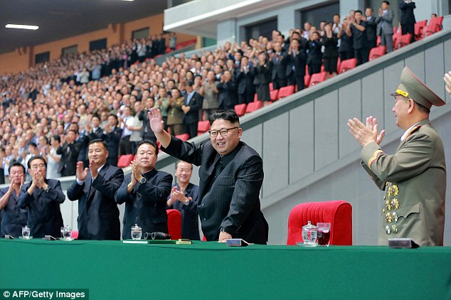 Kim Jong-un, pictured yesterday reciving applause, ordered the execution of two of his officials who showed him disrespect according to reports in South Korean newspapers 