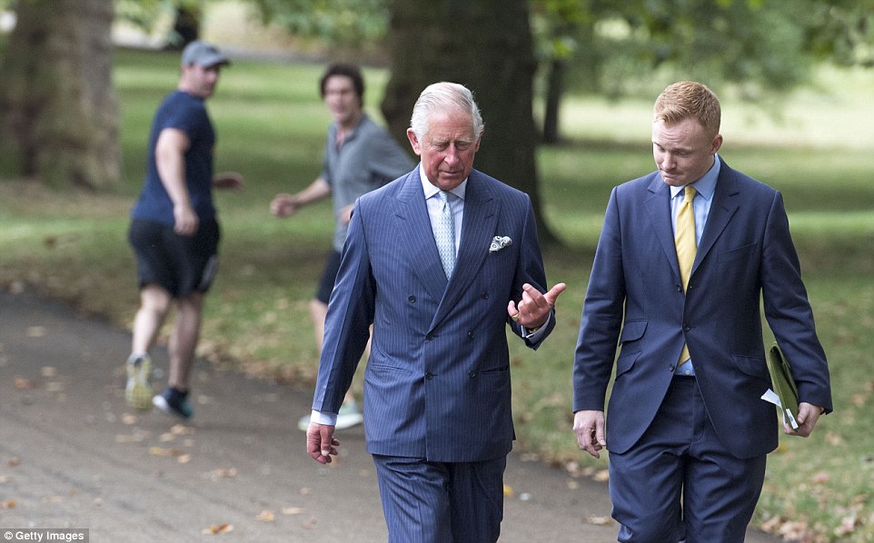 Hold on a minute: The two men turn around to check if they really did just see the Prince of Wales walking past them today