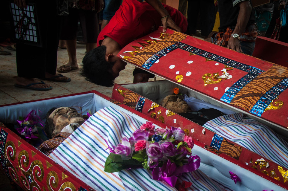 The locals dig up dead relatives to celebrate the ritual every three years