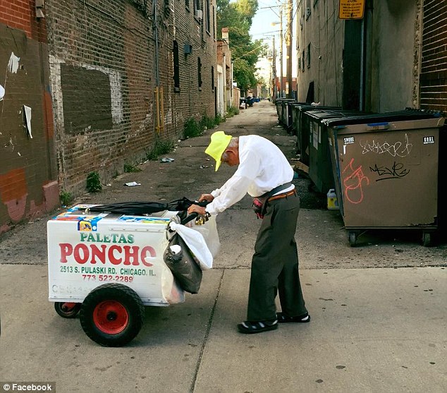 Joel Cervantes Macias was driving through the Little Village area in Chicago on Thursday when he saw Fidencio Sanchez having a hard time pushing his paleta cart (pictured)