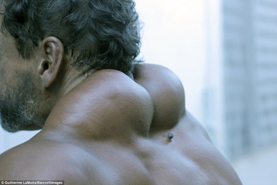 From behind his neck and back muscles make him look like something from the movie X-Men