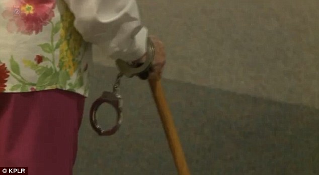 The 102-year-old was 'arrested' and even had handcuffs placed on her wrist as she fulfilled a long-time wish