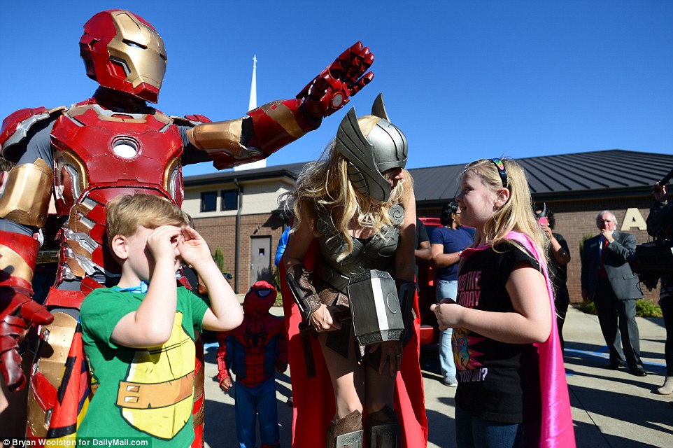 Jacob, a classmate and a first-grade teacher were struck by bullets as they left for recess last Wednesday. Above, people dressed as superheroes for Jacob's funeral