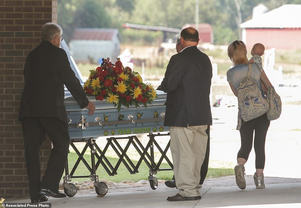The casket of six-year-old  Jacob Hall arrives for a wake service at Oakdale Baptist Church in Townville 